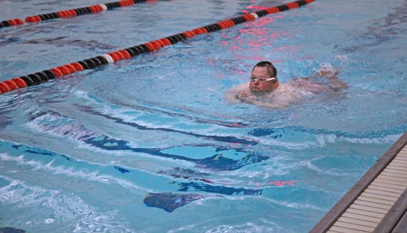 A person swimming laps in a pool