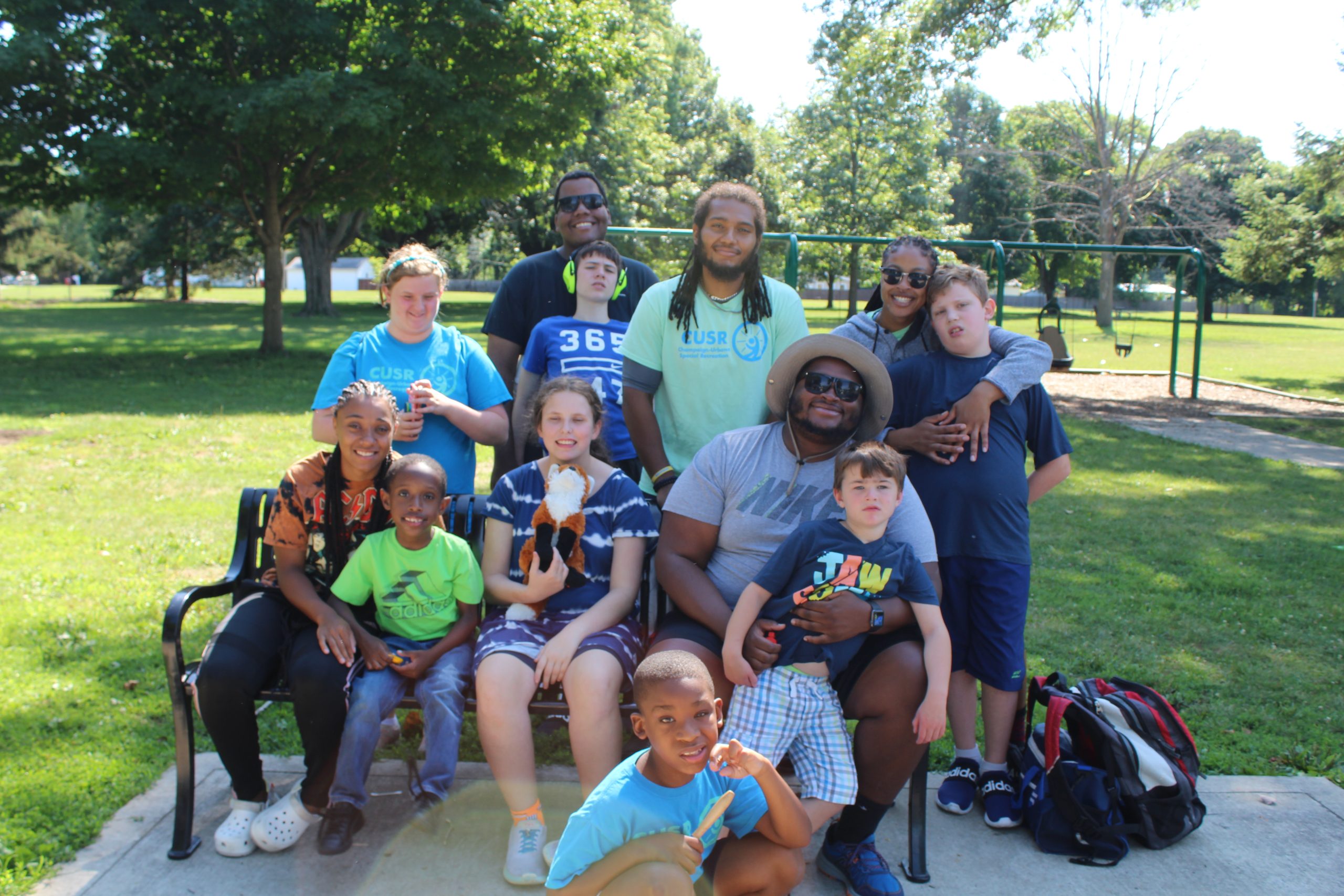 Campers at the park with a staff member