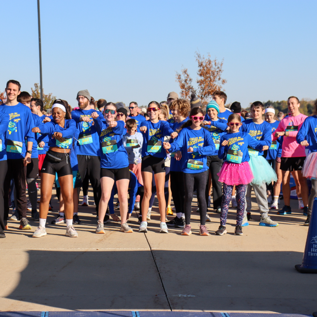 Group of runners in blue Cupcake 5k shirts